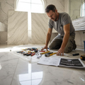 Installer prepping spacious marble bathroom